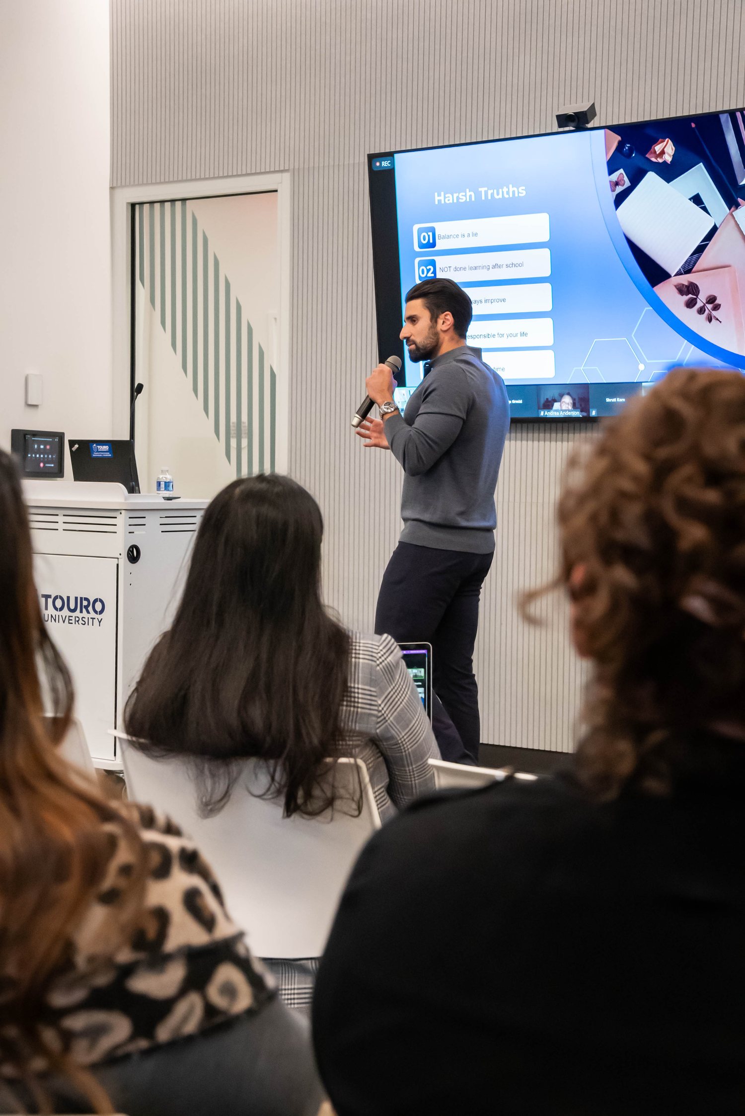 Jonathan Z. Cohen delivering the material to a live audience at Touro University
