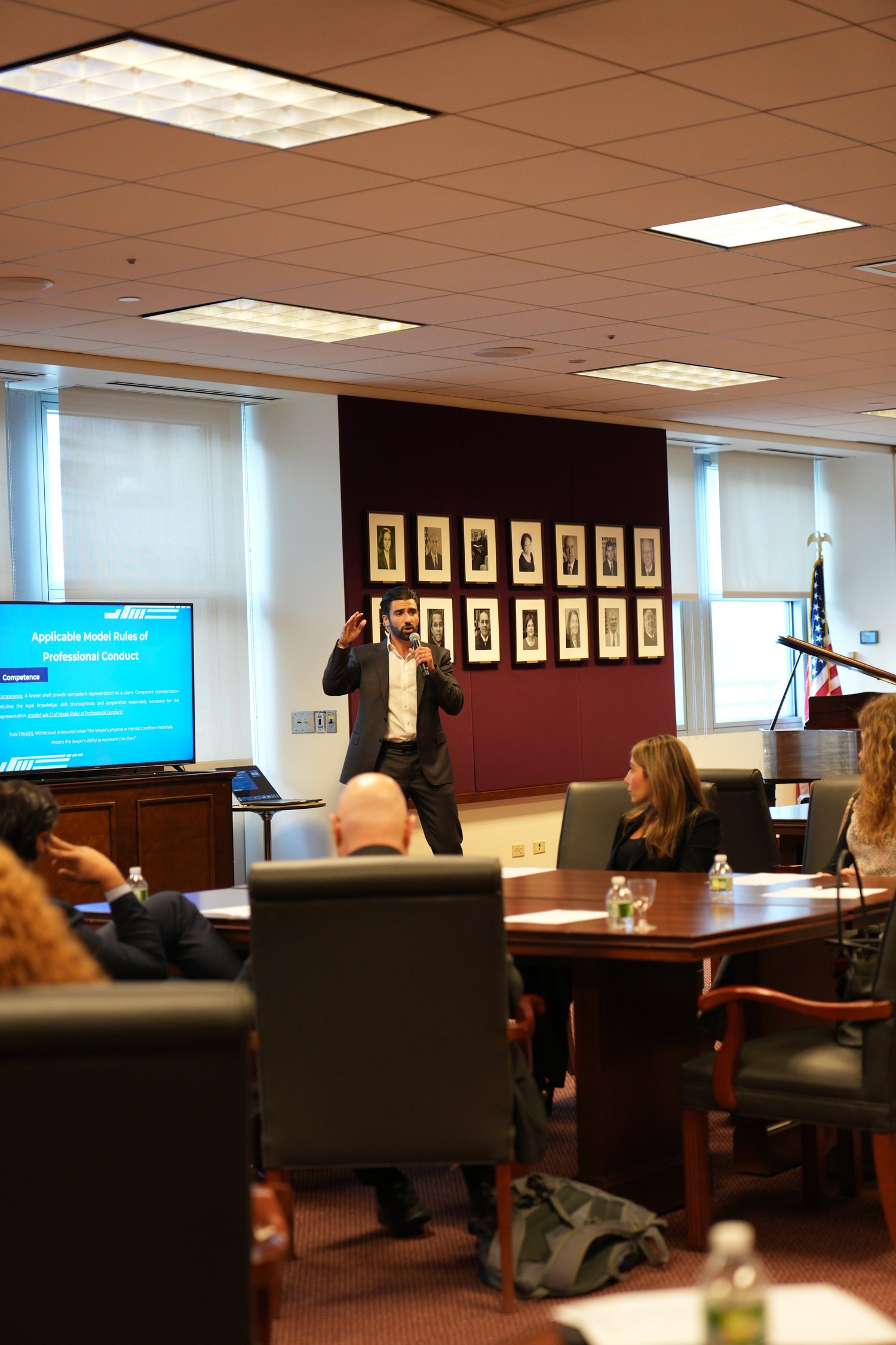 Jonathan Z. Cohen presenting to a legal audience with a slide titled Applicable Model Rules of Professional Conduct